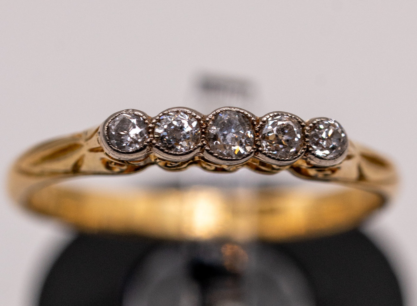 18k five stone milgrain bezel diamond band